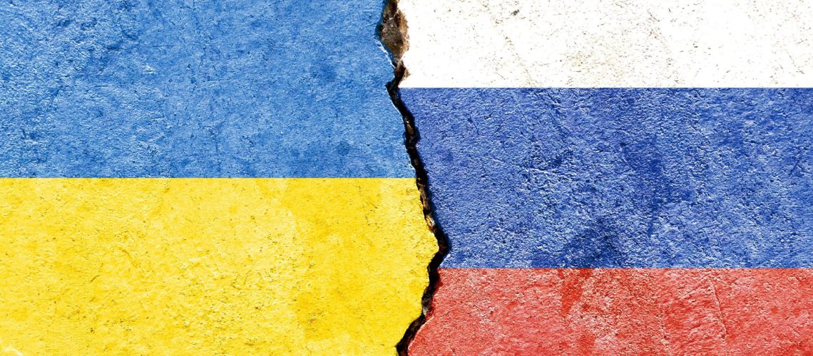 an illustration of the flags of Ukraine and Russia separated by a crack - conflict or comparison